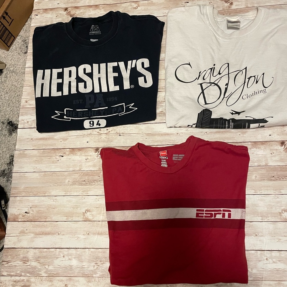 Three Men’s Medium T shirts. Well worn, various designs.